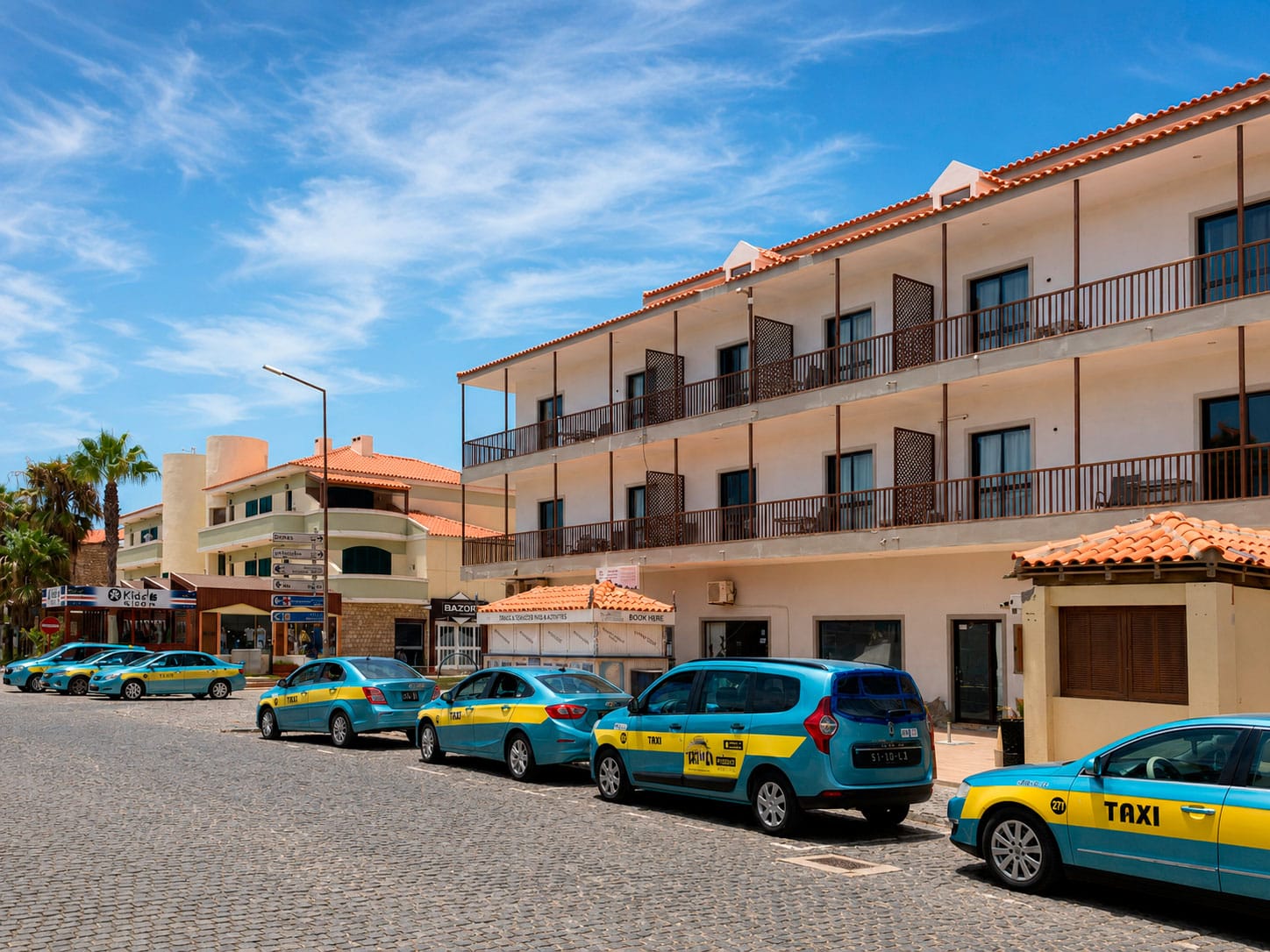 Blue and yellow taxis parked in Santa Maria on Sal Island, Cape Verde